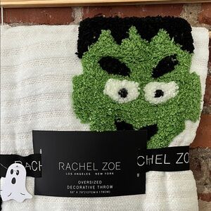 Rachel Zoe White Throw with Green Monster Design